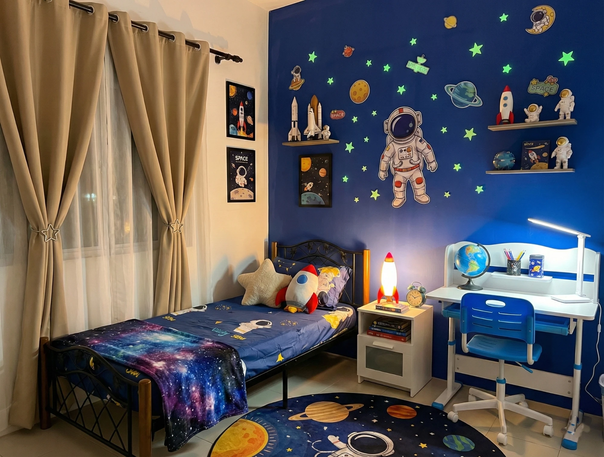 Space themed kids bedroom with glow-in-the-dark stars, astronaut mural and rocket lamp at Aydan Wonderland Homestay Kuantan